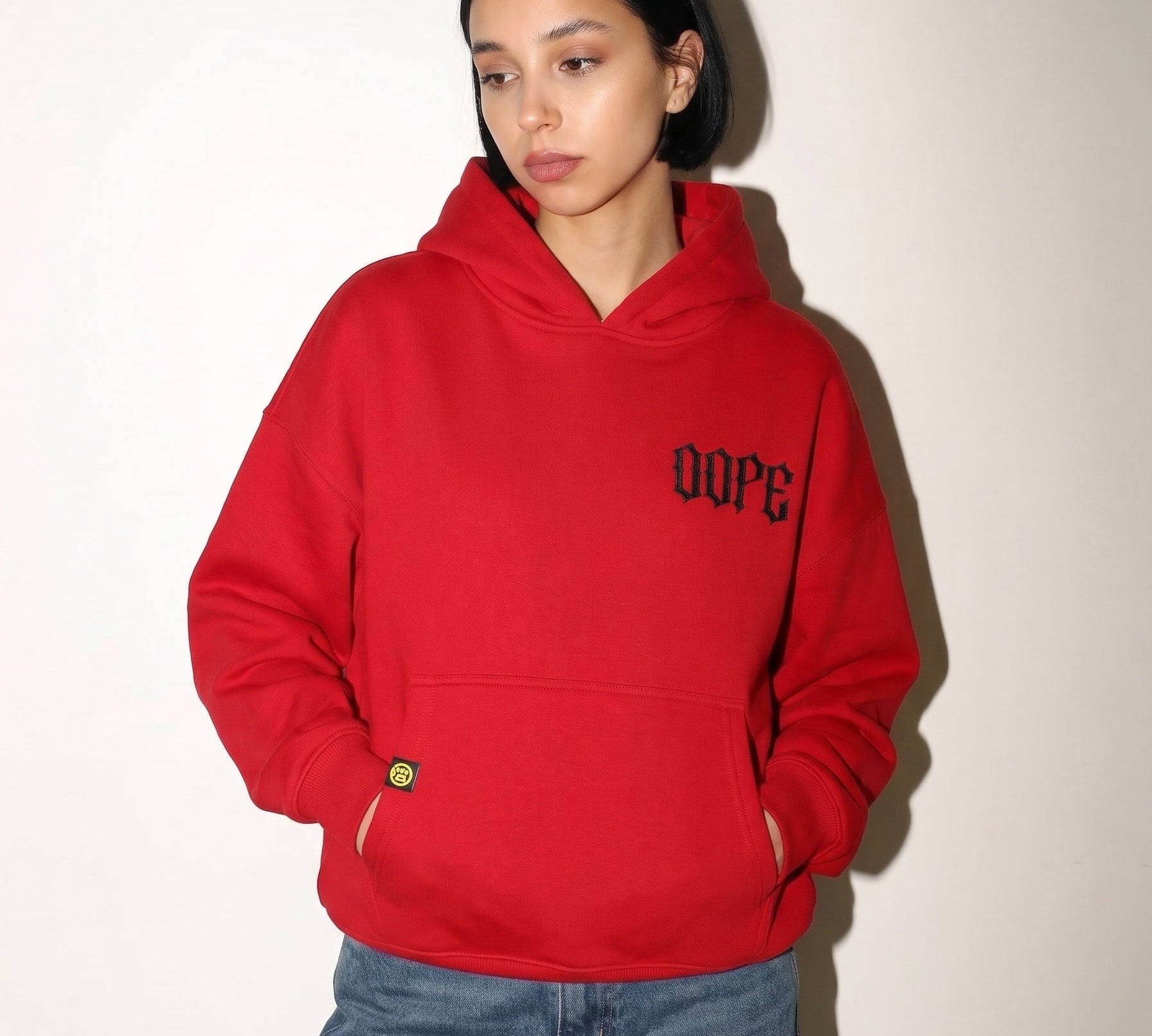 Red 222 angel number hoodie by Dope Beyond – front view on female model