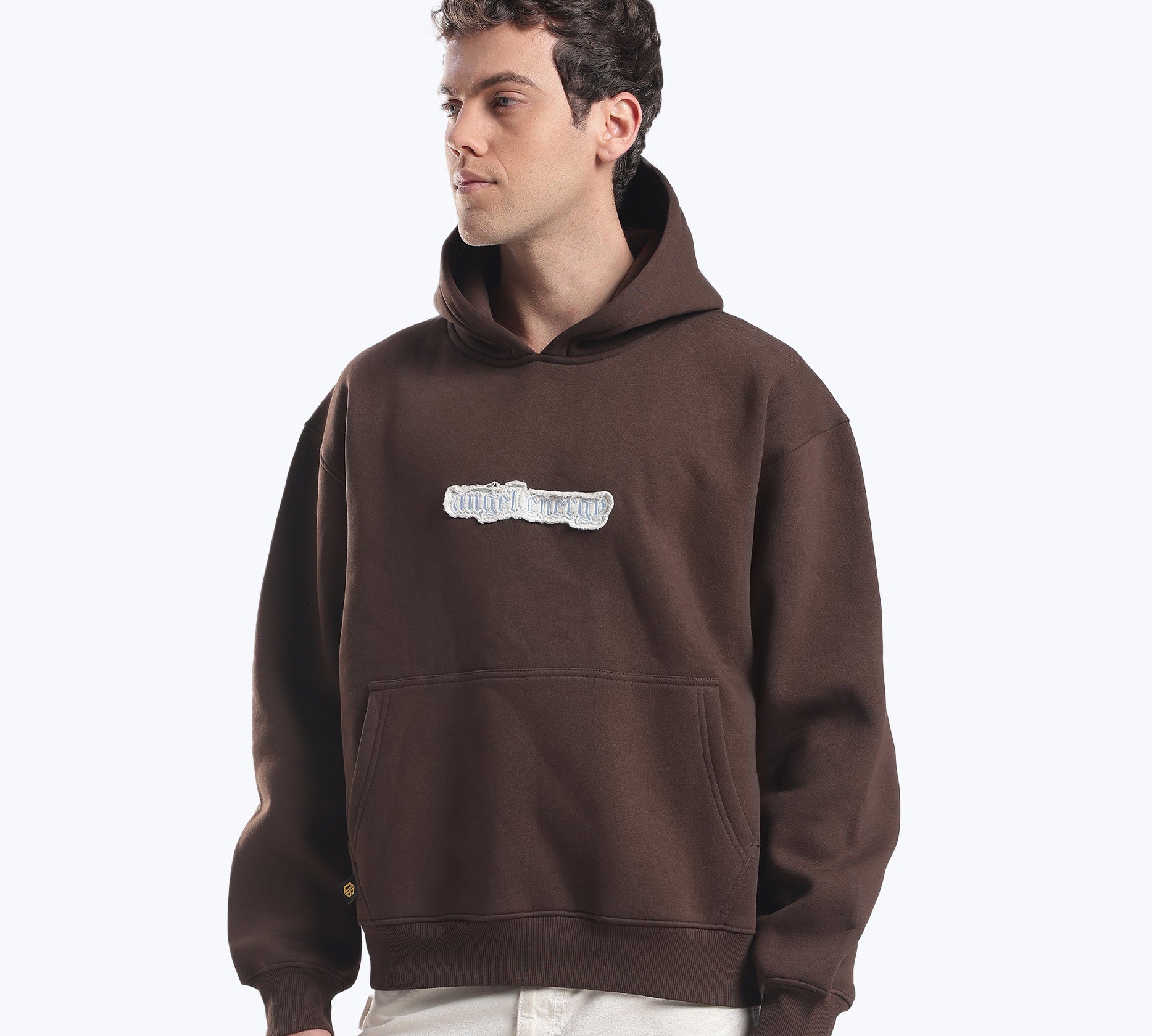 Brown 555 heavyweight hoodie by Dope Beyond on model showing oversized fit