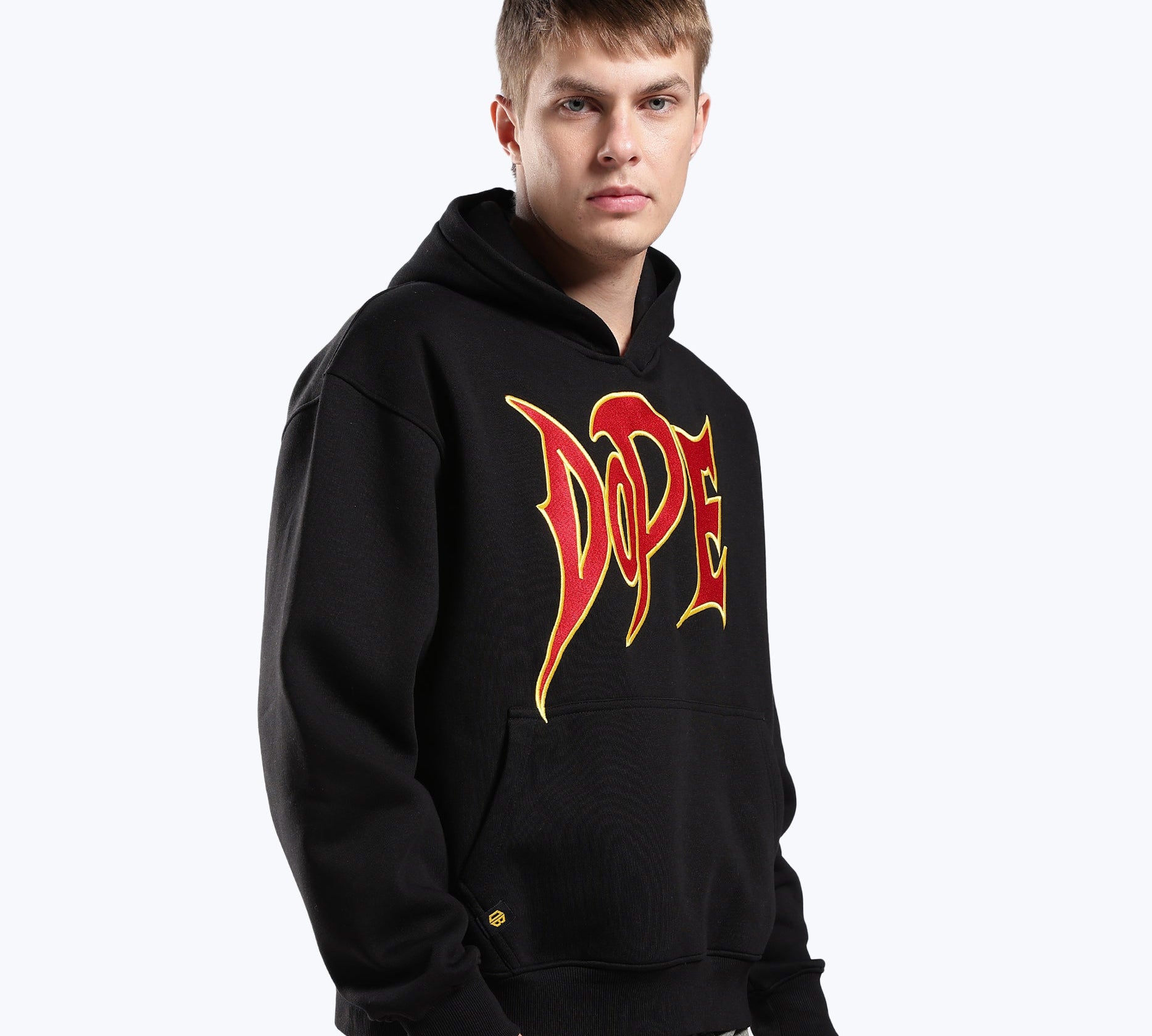 Male model in the black 777 lightning graphic heavyweight hoodie by Dope Beyond