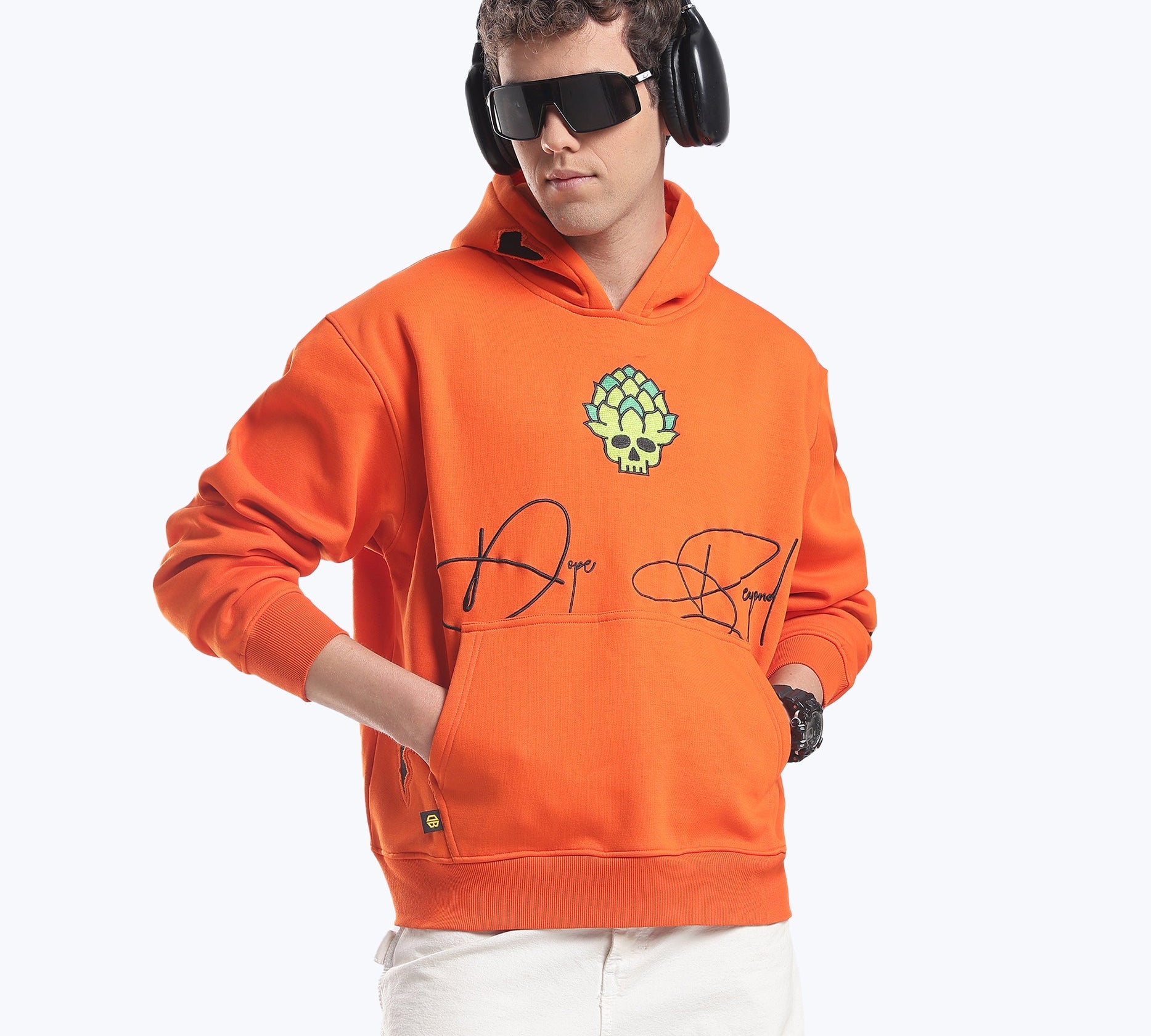 Model in the orange Skull in Bloom graphic heavyweight hoodie by Dope Beyond