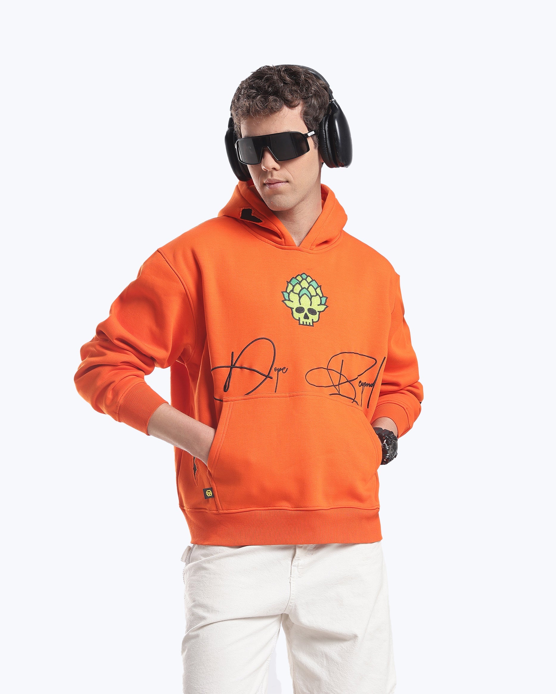 Model in the orange Skull in Bloom graphic heavyweight hoodie by Dope Beyond