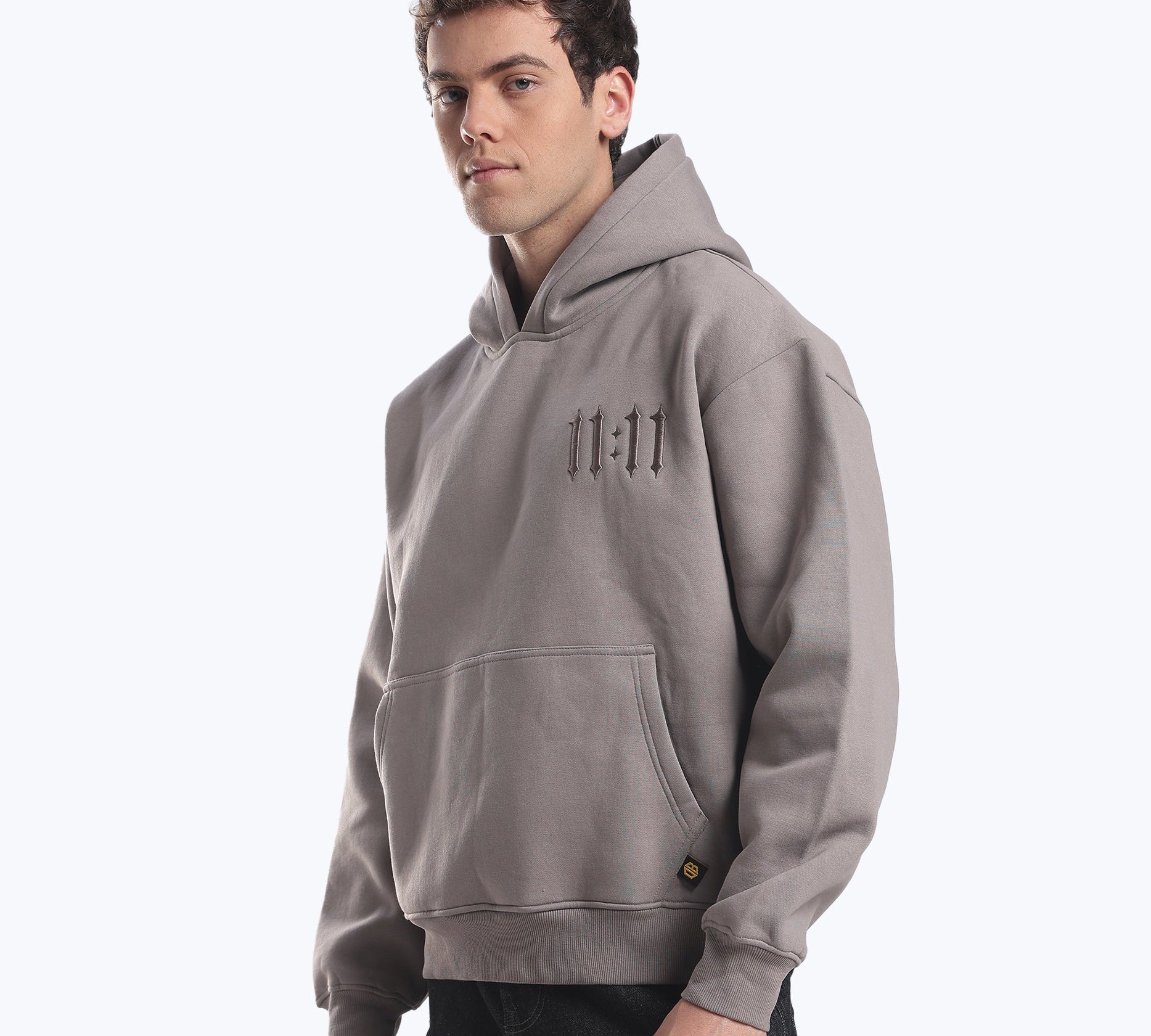 Grey 11:11 angel number hoodie on model, representing the 1s energy of 1212, by Dope Beyond