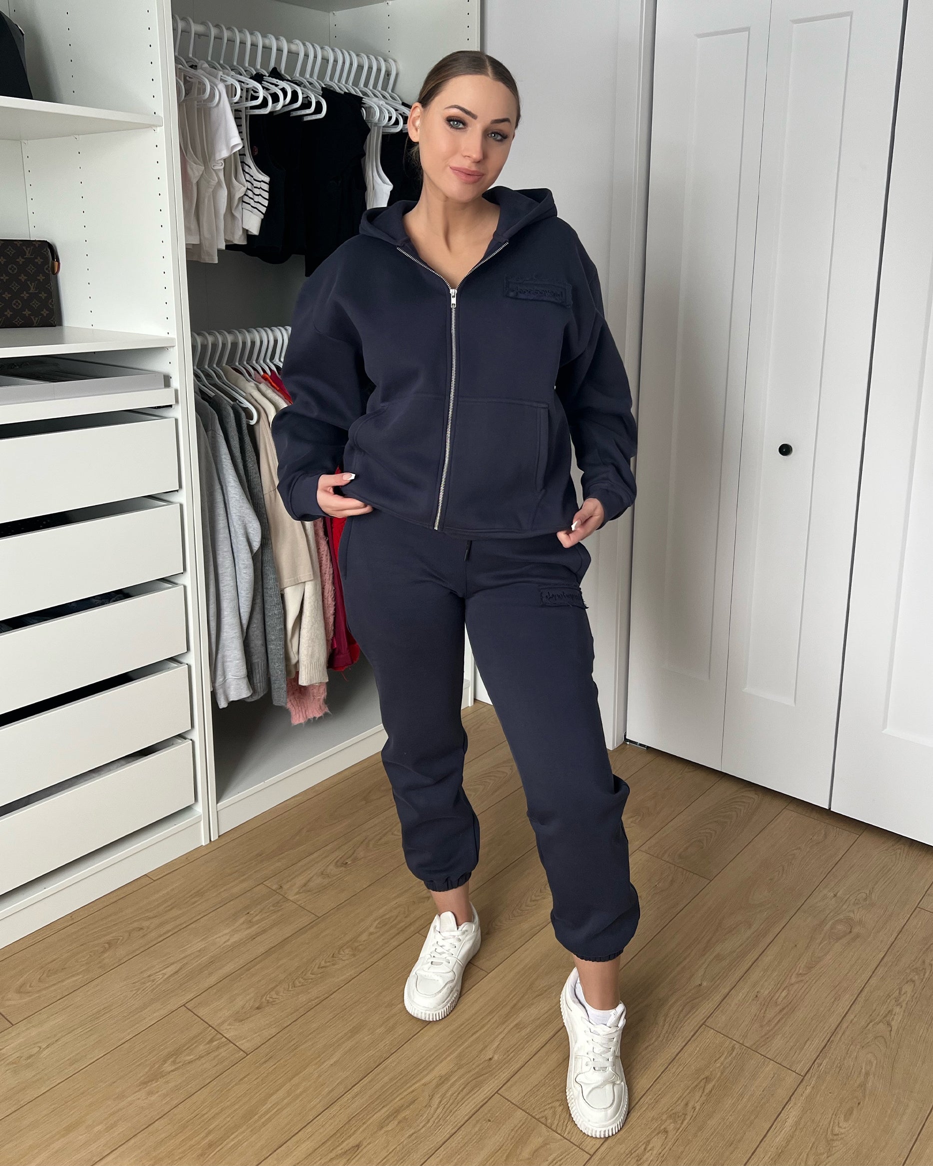 Model in the ink navy heavyweight zip hoodie and matching joggers by Dope Beyond