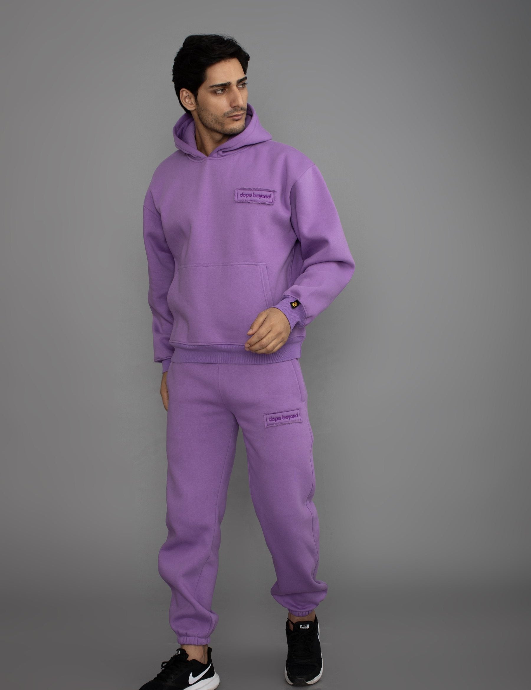 Man in the Dope Beyond Lavender hoodie and joggers set, full length, studio