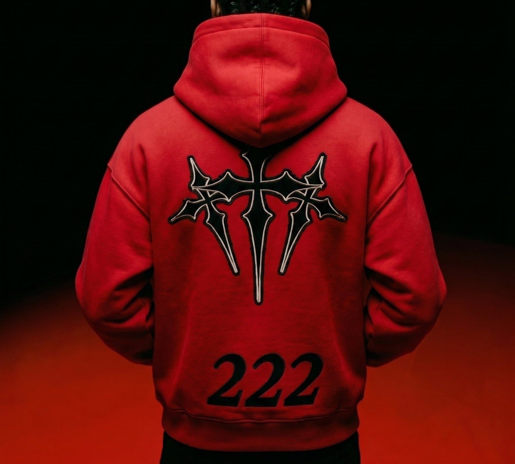 Male model showing the back graphic of the red 222 angel number heavyweight hoodie by Dope Beyond