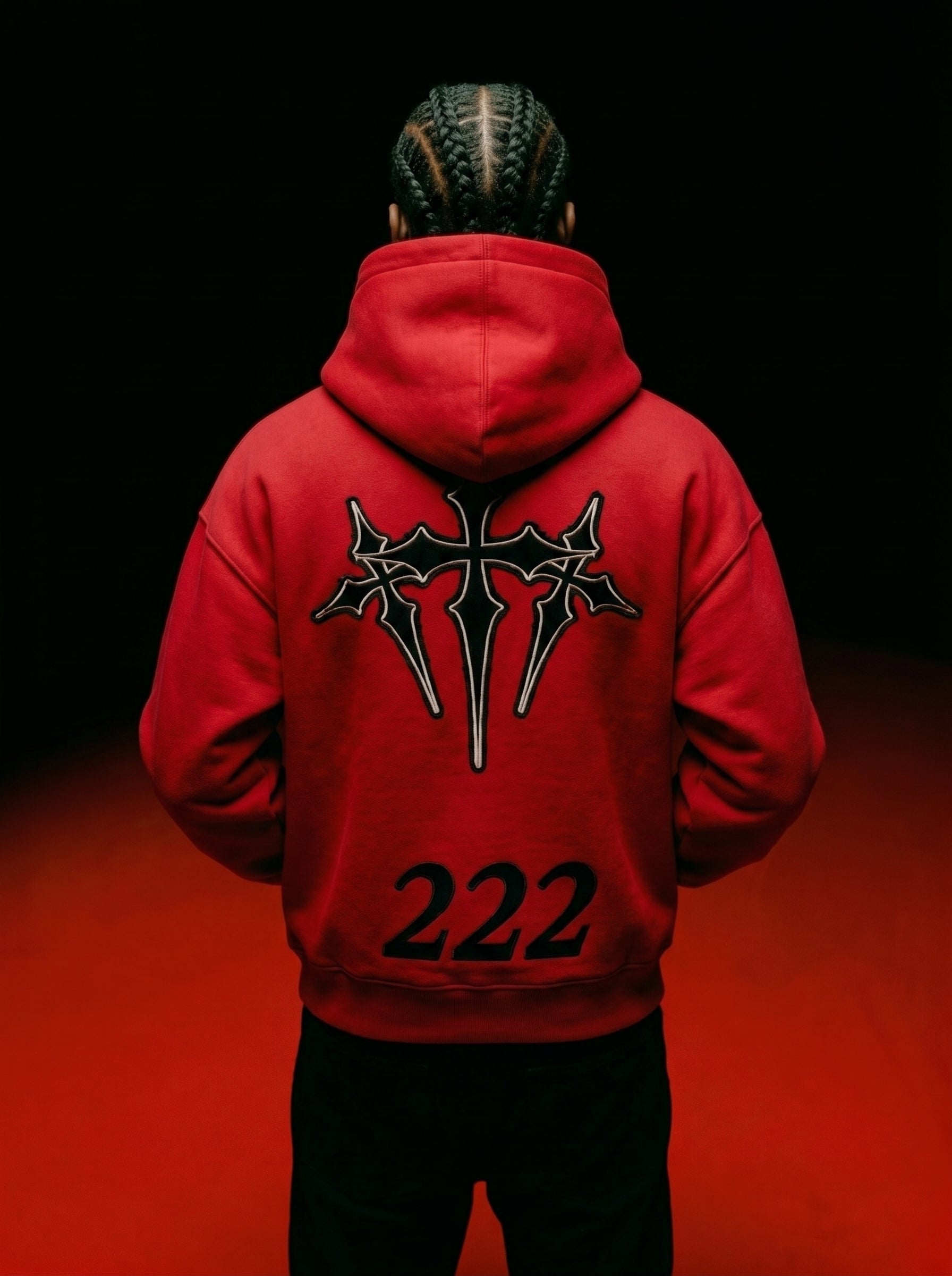 Male model showing the back graphic of the red 222 angel number heavyweight hoodie by Dope Beyond