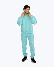 Man wearing light blue dopebeyond streetwear hoodie and joggers, sporty urban style