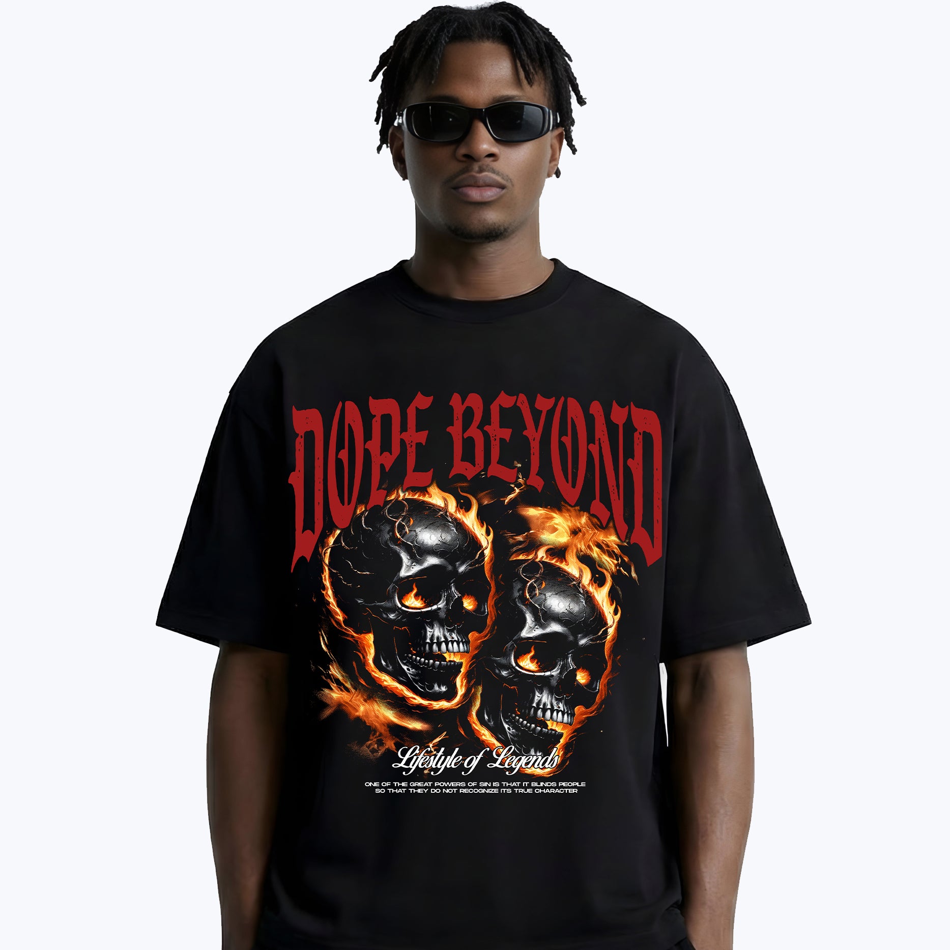 Man wearing black DOPE BEYOND graphic tee with flaming skulls streetwear design