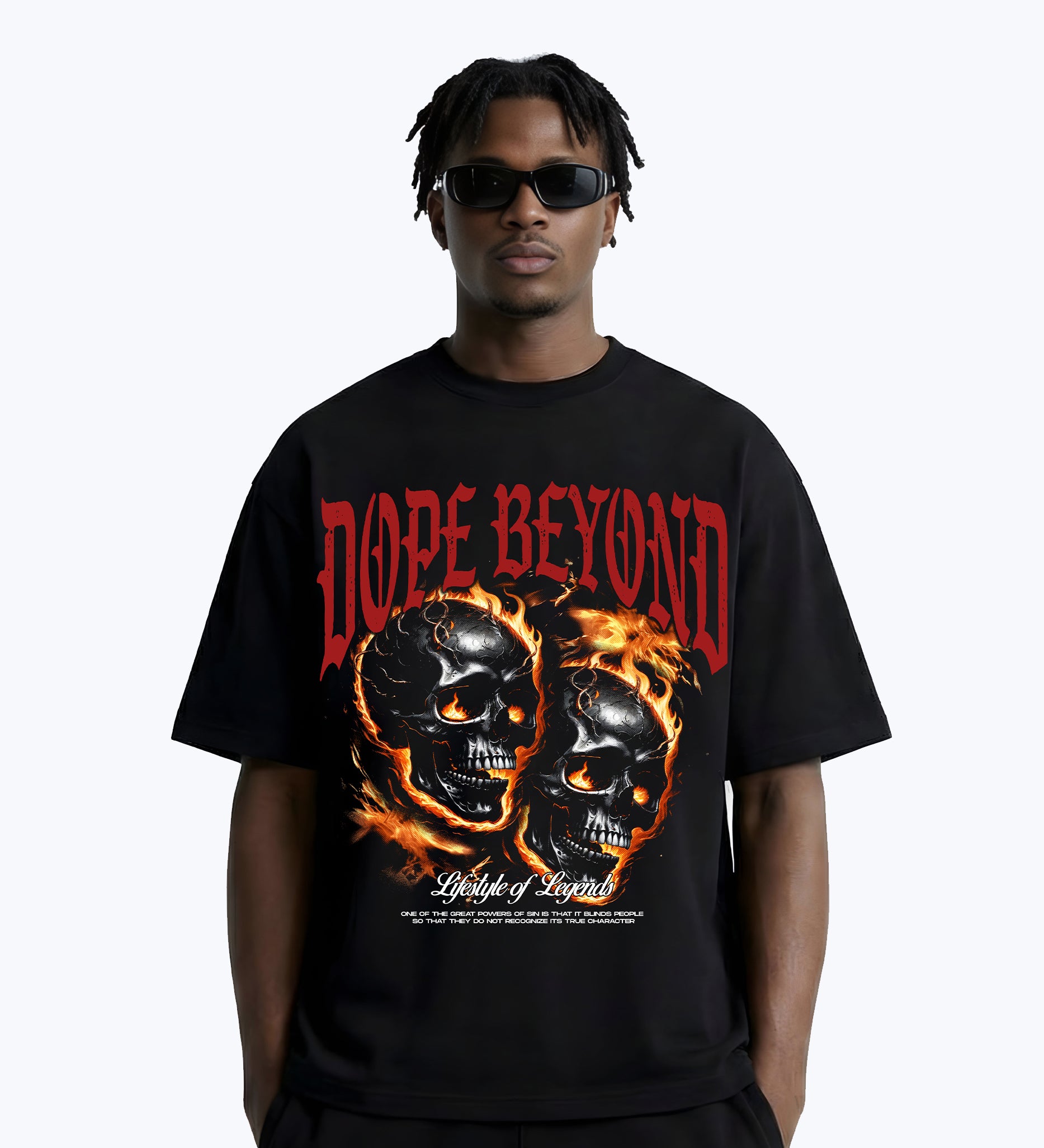 Man wearing black DOPE BEYOND graphic tee with flaming skulls streetwear design