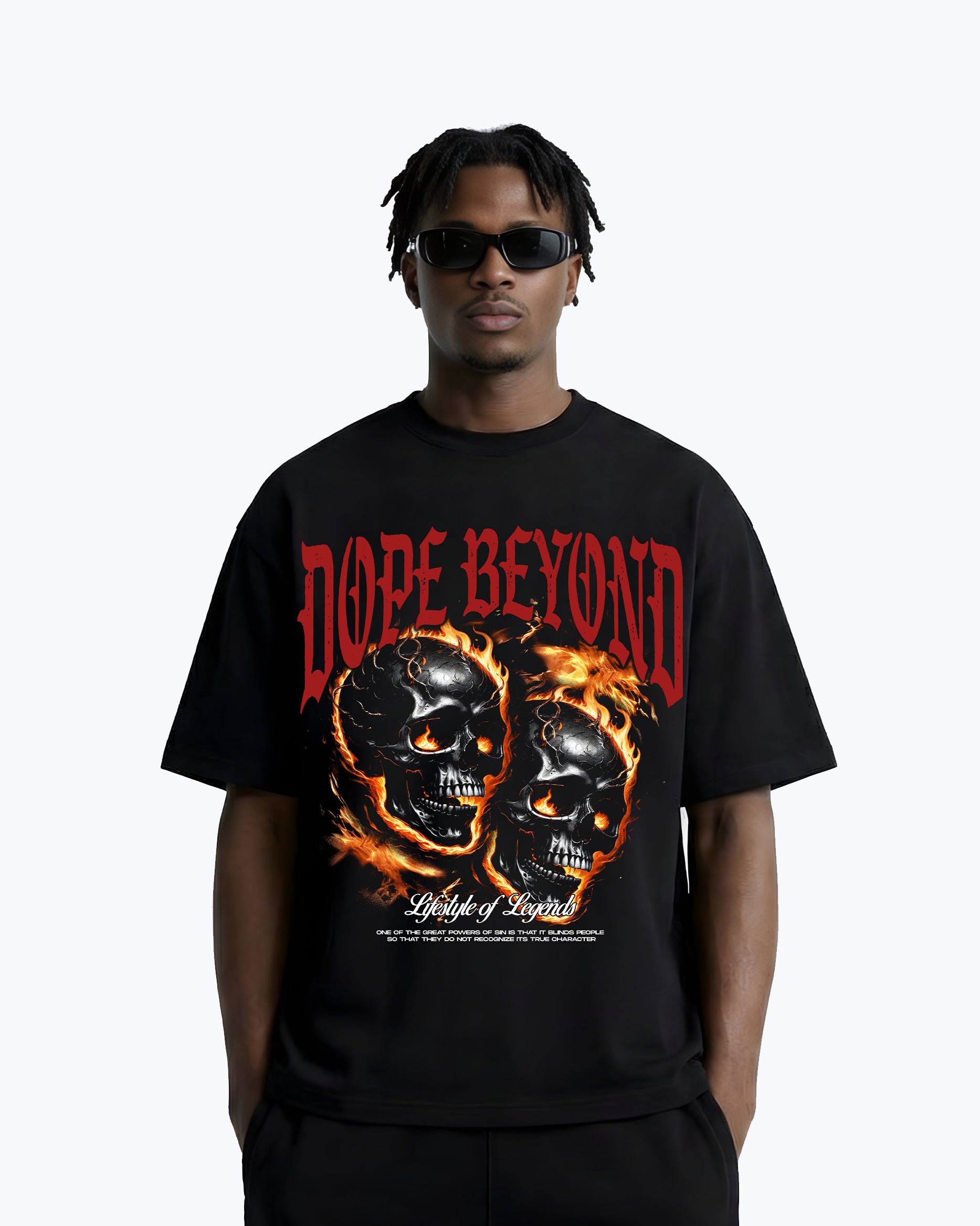Man wearing black DOPE BEYOND graphic tee with flaming skulls streetwear design