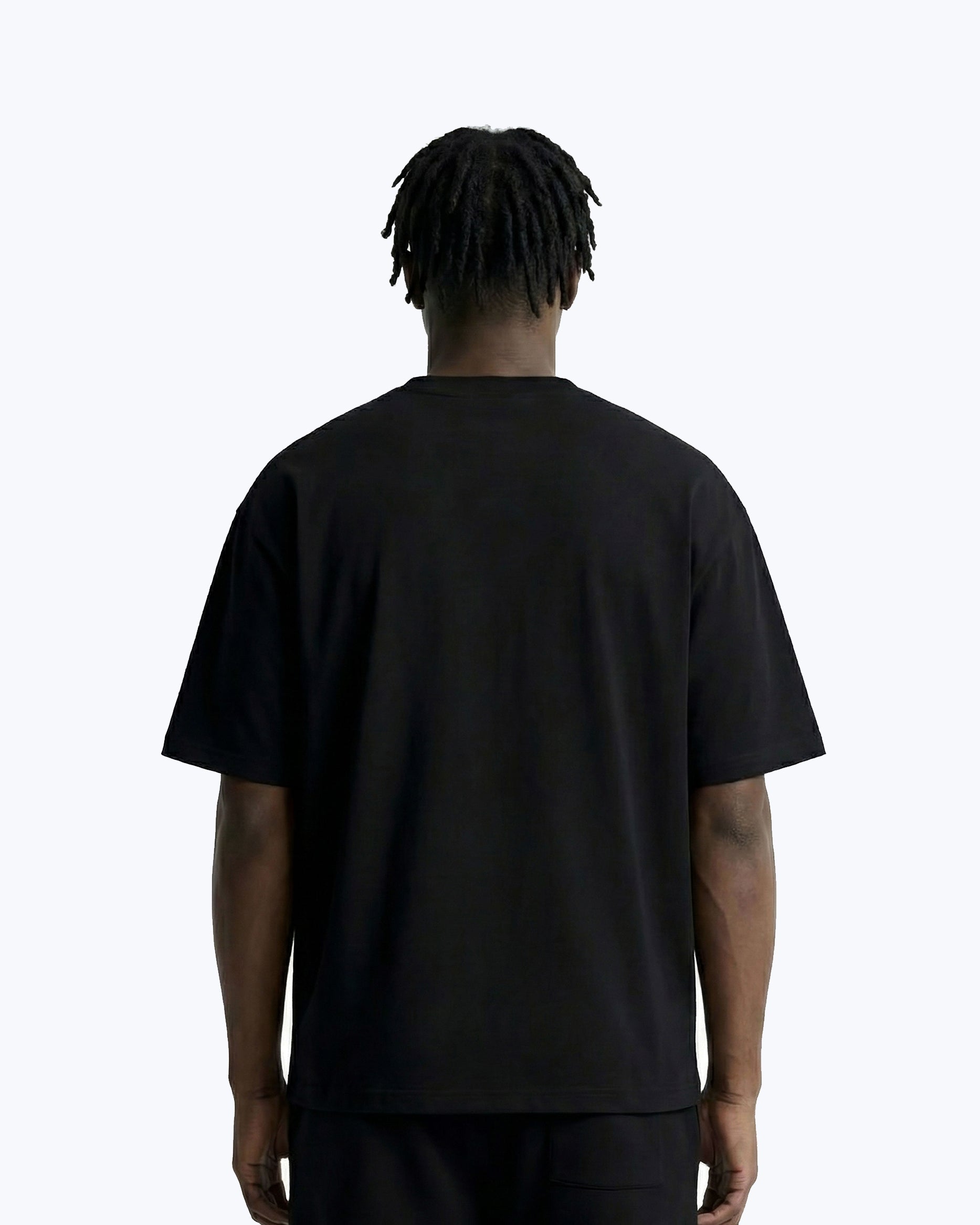 Back view of dopebeyond streetwear black t-shirt on male model against white background