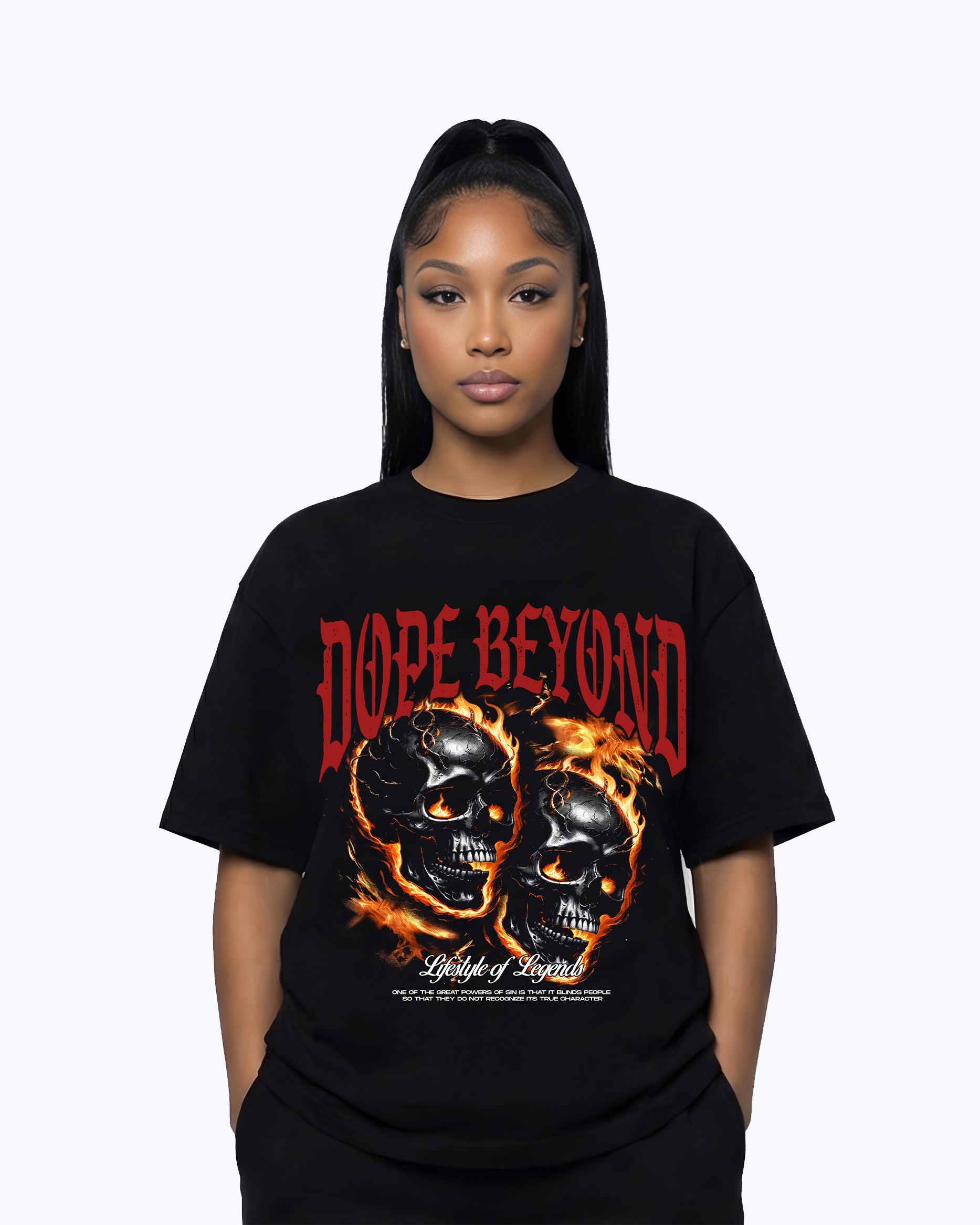 Woman wearing Dope Beyond black graphic streetwear t-shirt with flaming skulls and bold red lettering.