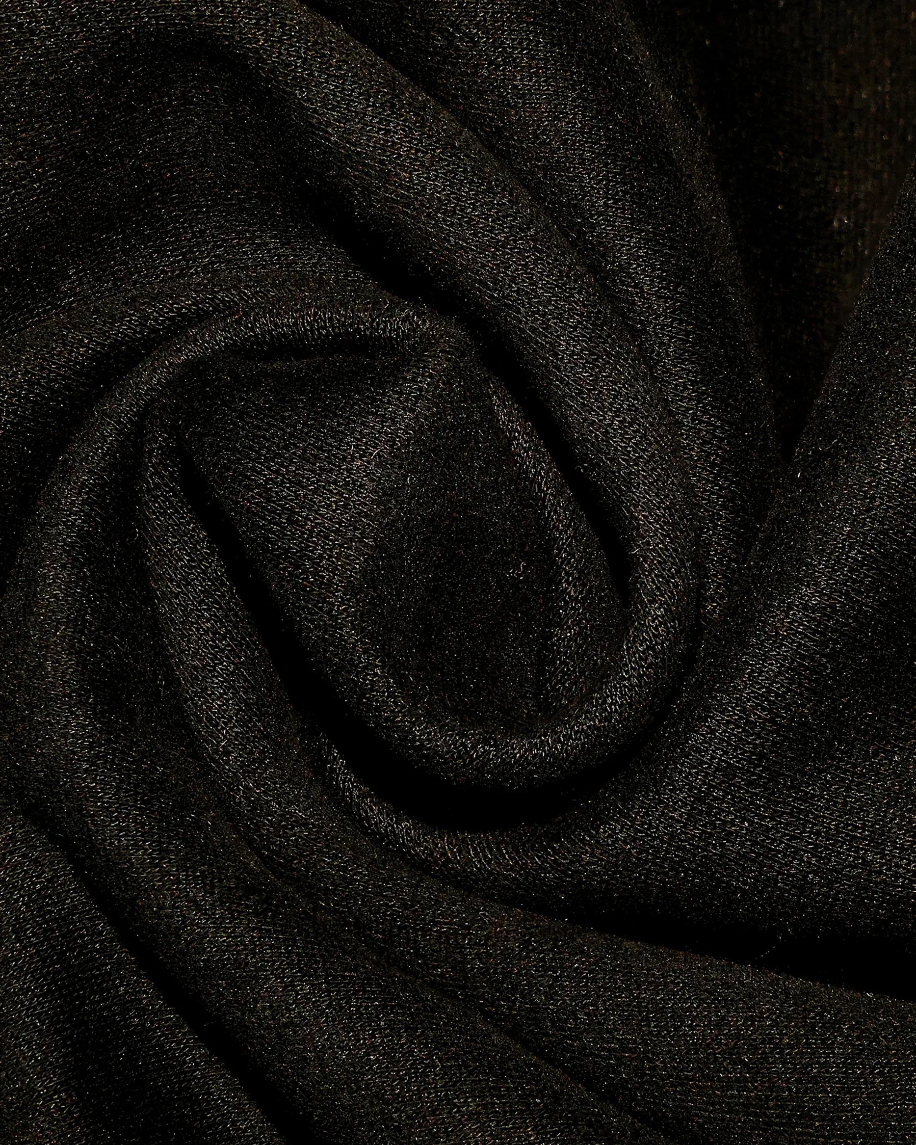Close-up of heavyweight black fleece fabric detail for Dope Beyond streetwear hoodie