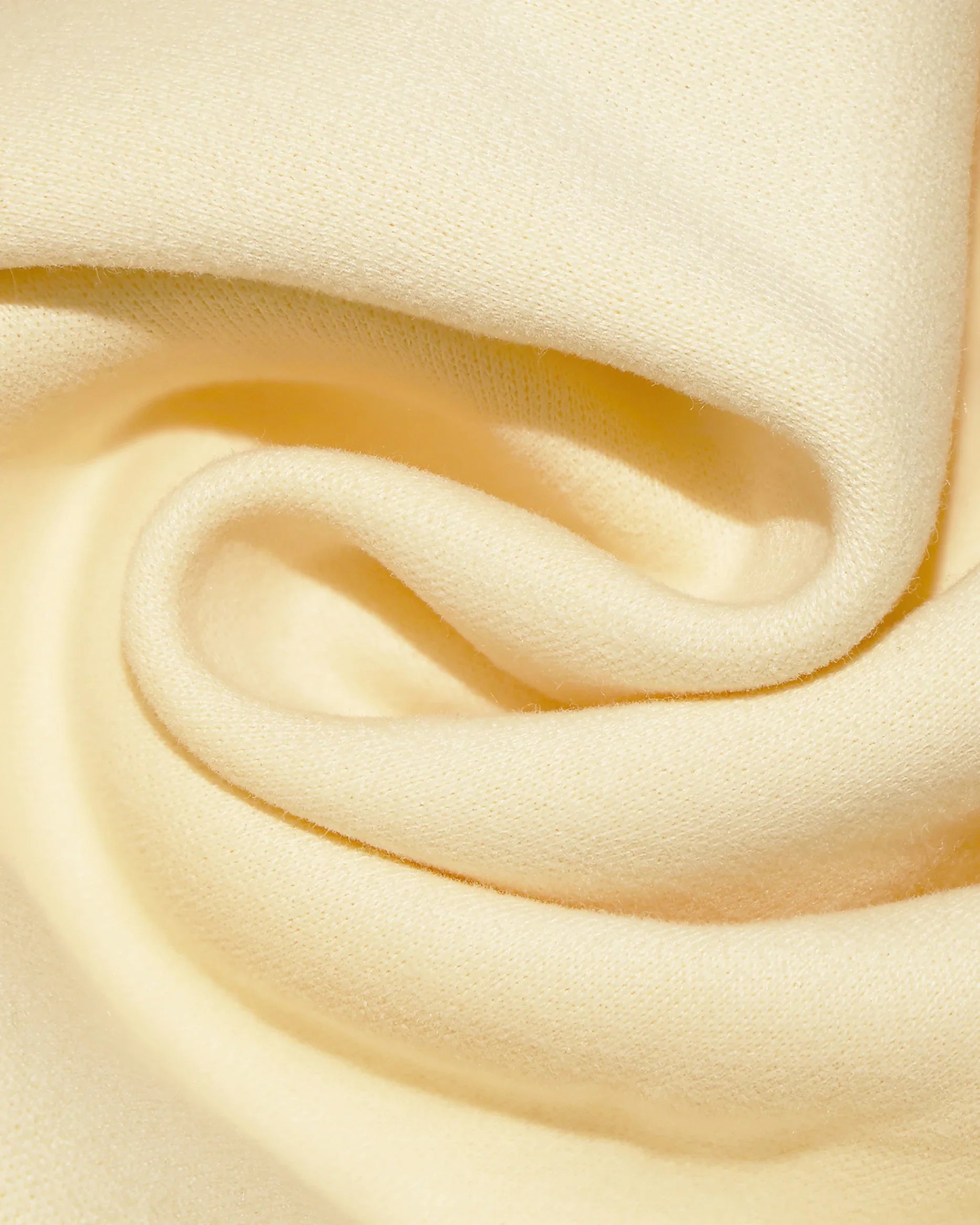 Dope Beyond Dutch white heavyweight hoodie fabric close-up, soft streetwear texture detail