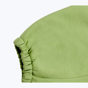 Green streetwear jogger pants with ruched detail, Dope Beyond apparel close-up