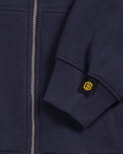 dopebeyond heavyweight hoodie sleeve detail with yellow DB tag and metal zipper