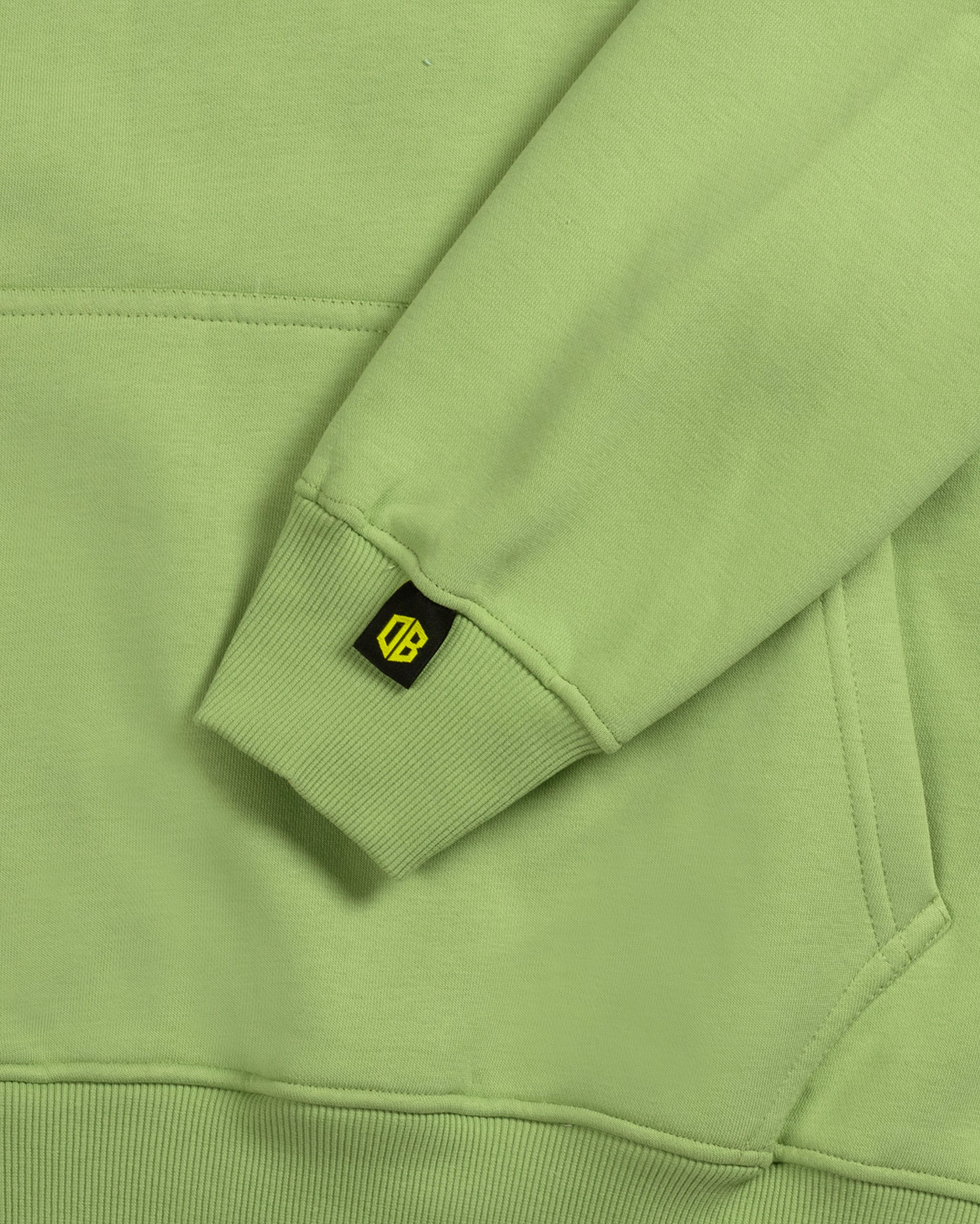 Dope Beyond green heavyweight streetwear hoodie sleeve detail with logo tag