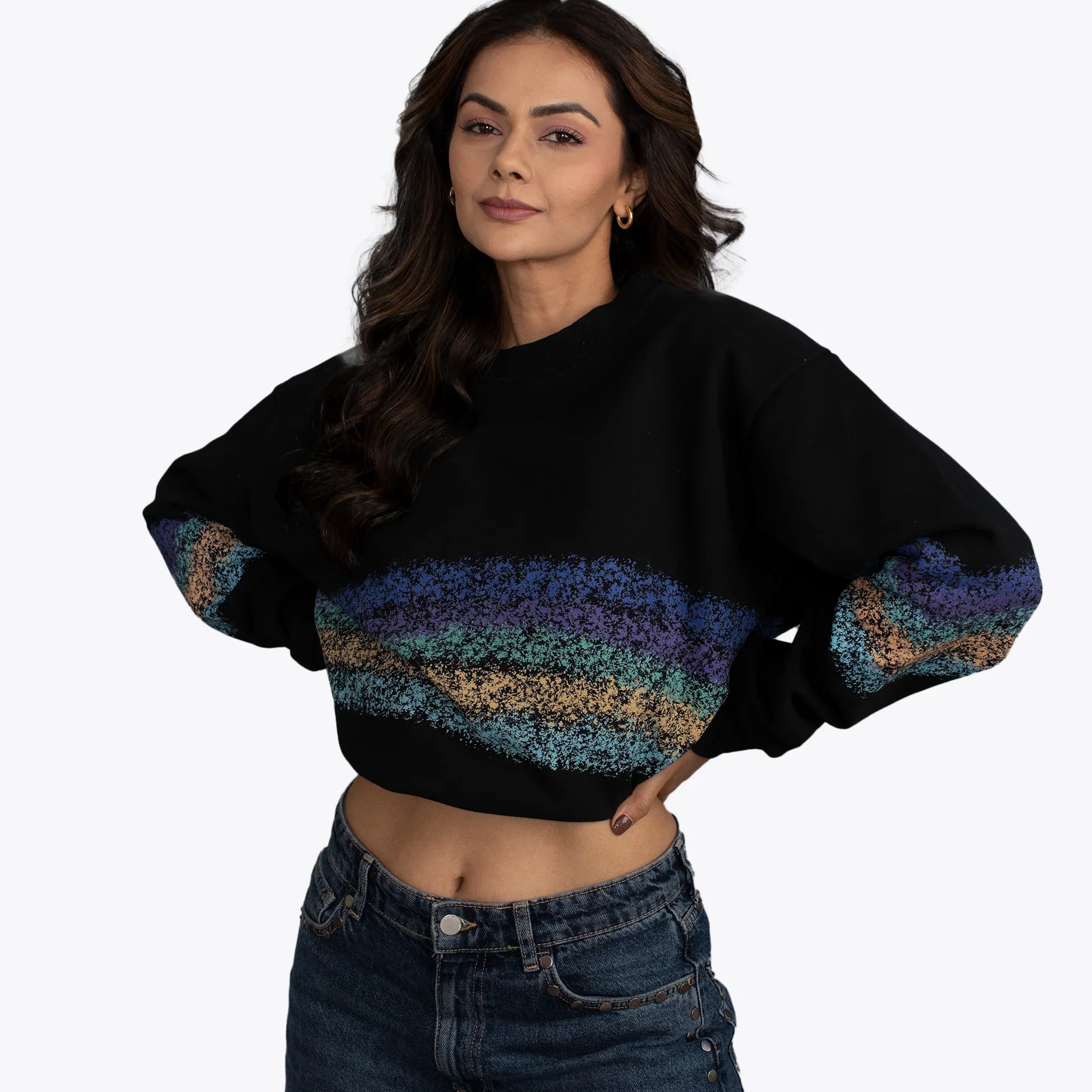 Woman modeling black cropped hoodie with colorful textured stripes, dopebeyond streetwear style