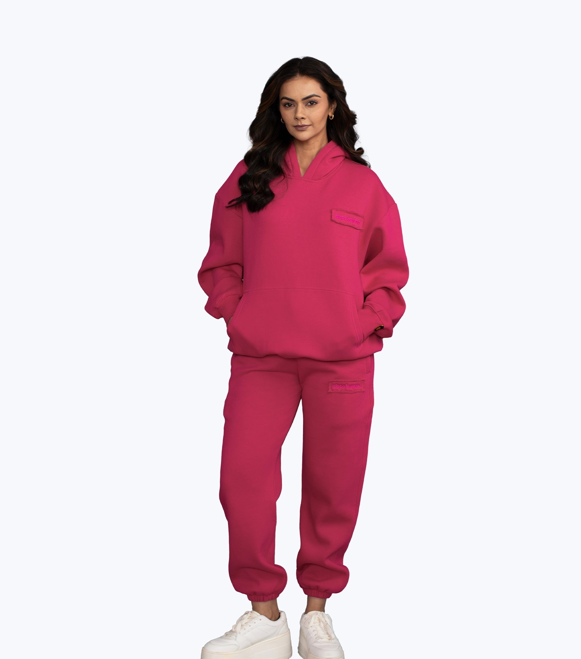 Hot pink Signature hoodie and joggers set by Dope Beyond – front view on female model