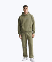 Olive green Legends hoodie and joggers set by Dope Beyond – front view on male model