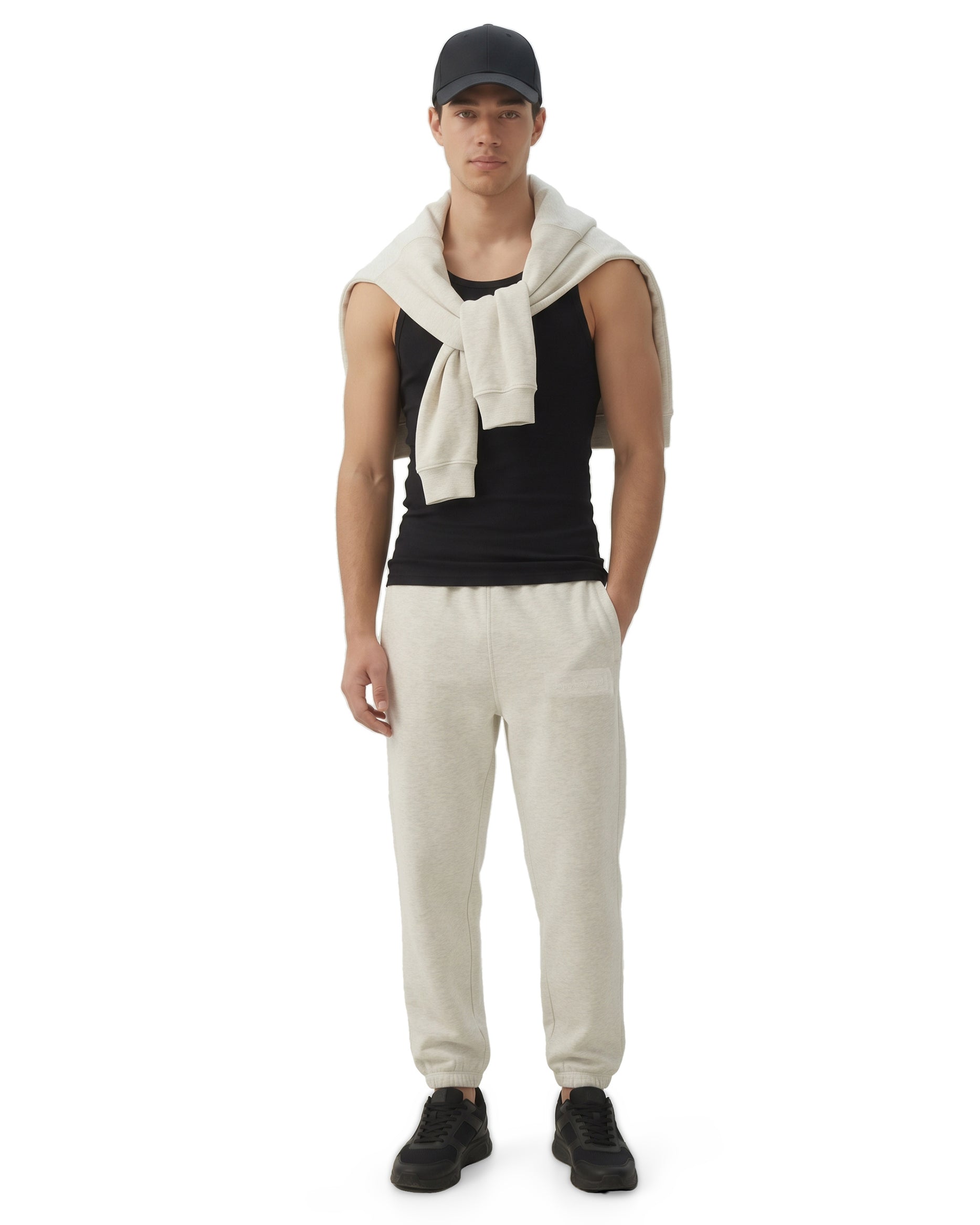 Ecru melange Signature heavyweight joggers by Dope Beyond – front view on male model with the zip hoodie over his shoulders