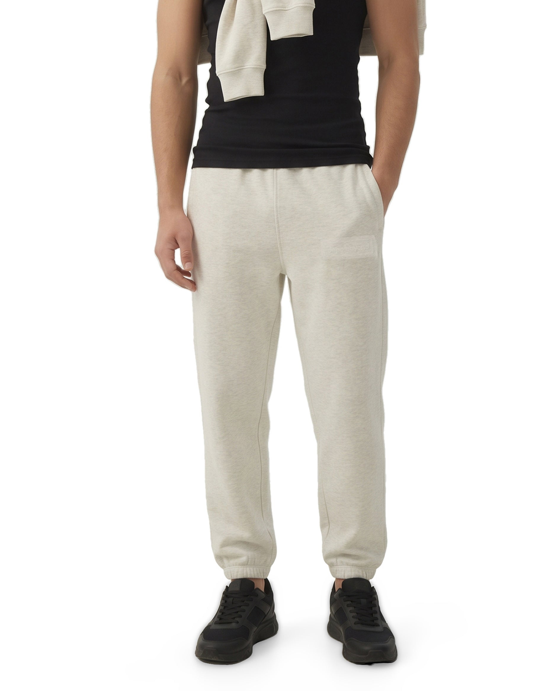 Ecru melange Signature heavyweight joggers by Dope Beyond – close-up front view on male model