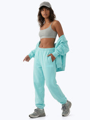 Aqua blue Signature heavyweight joggers by Dope Beyond – female model walking