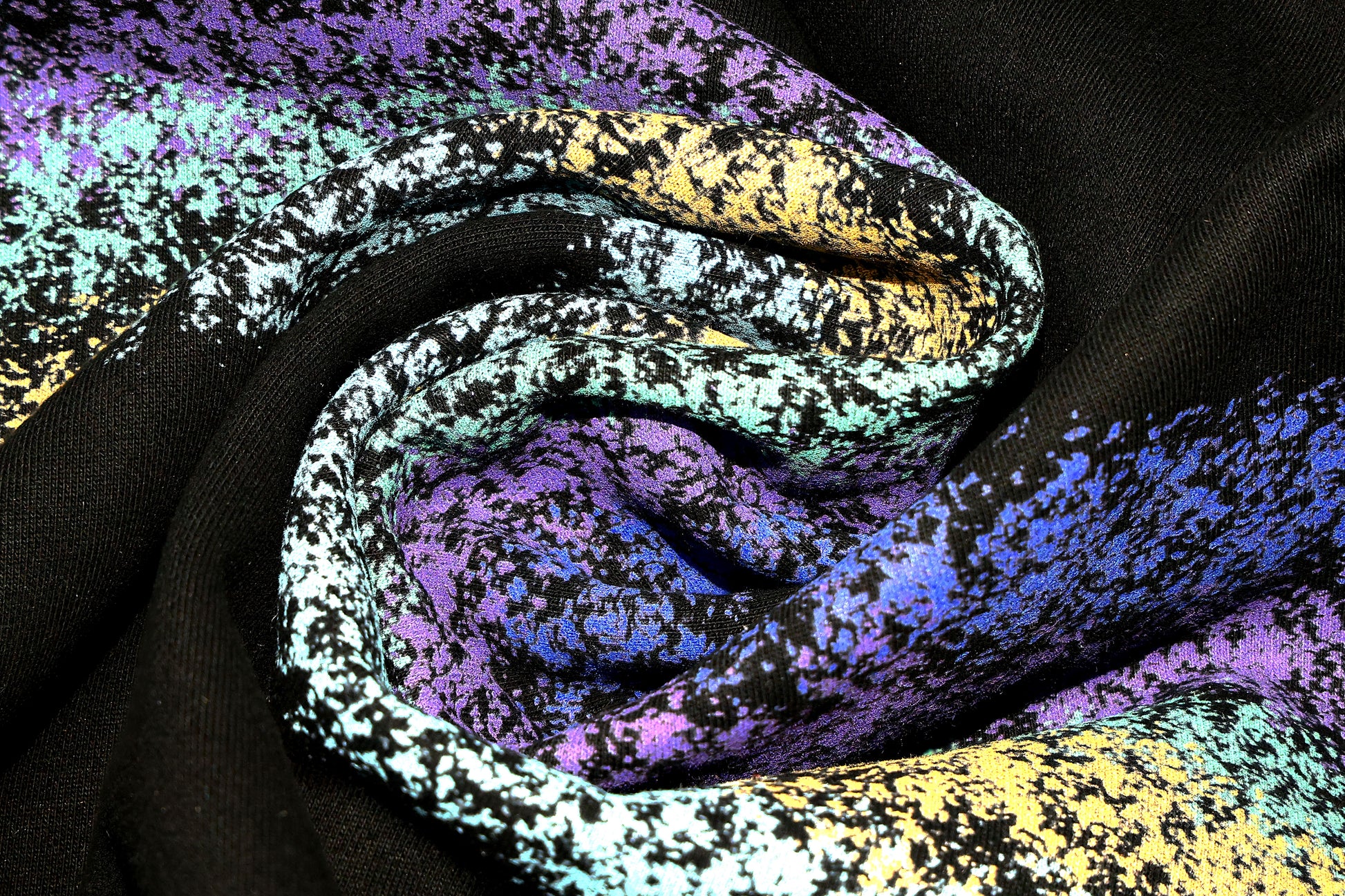 Close-up of colorful textured fabric detail on Dope Beyond Crewneck Sweatshirt in black