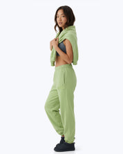 Mint green Signature heavyweight joggers by Dope Beyond – side view on female model