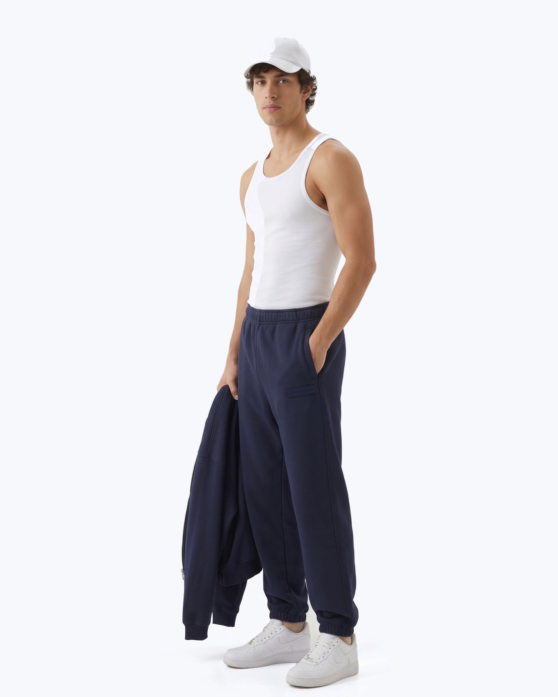 Ink navy Signature heavyweight joggers by Dope Beyond – side view on male model