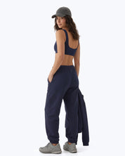 Ink navy Signature heavyweight joggers by Dope Beyond – back view on female model