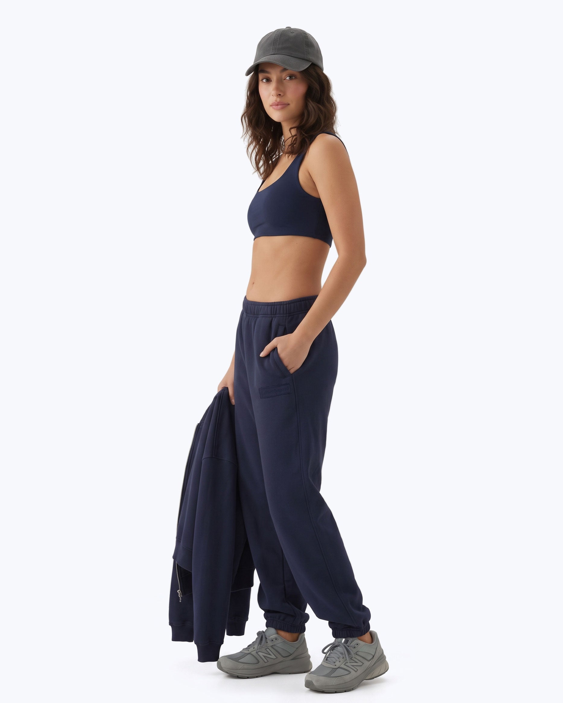 Ink navy Signature heavyweight joggers by Dope Beyond – side view on female model