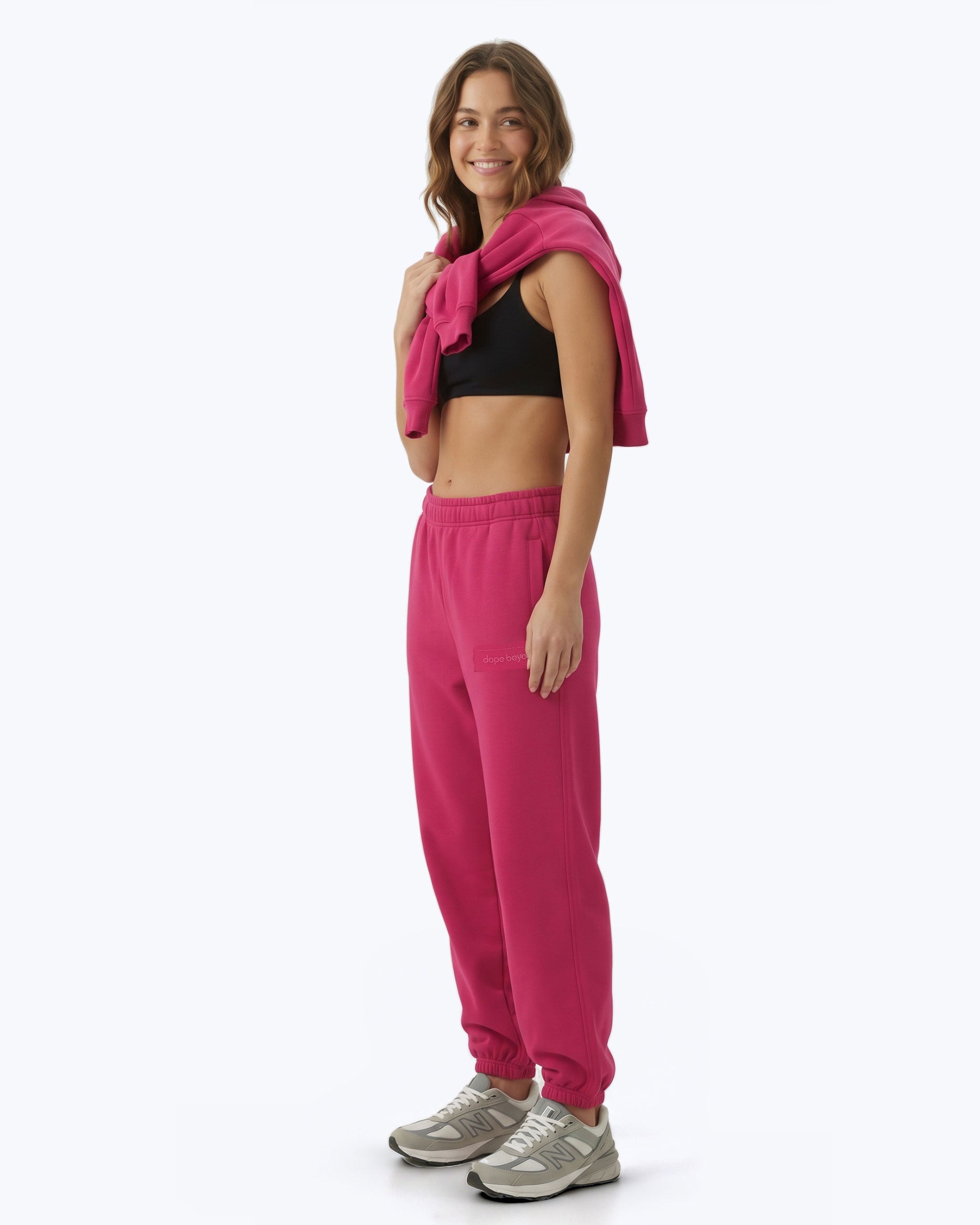 Hot pink Signature heavyweight joggers by Dope Beyond – side view on female model