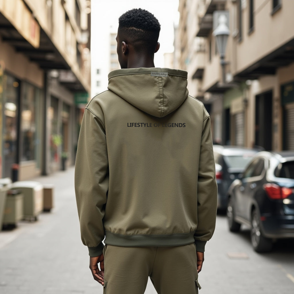 Man wearing Lifestyle of Legends Hoodie - Olive Green by dopebeyond standing in an urban street