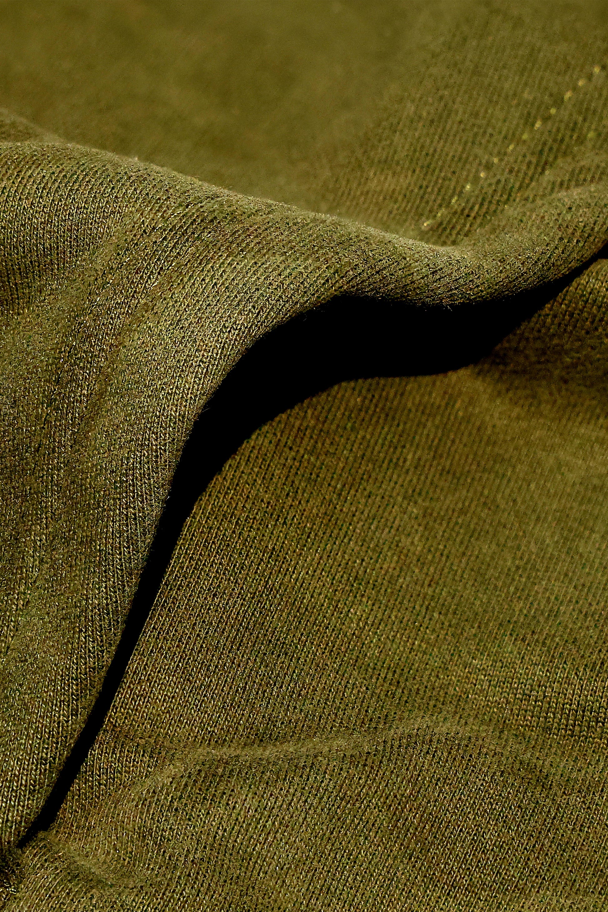Close-up texture of dopebeyond Lifestyle of Legends Hoodie - Olive Green fabric showing soft knit details