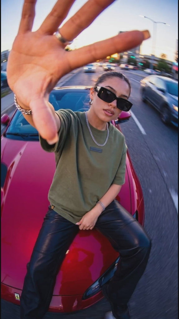 Olive green heavyweight tee by Dope Beyond – lifestyle video on female model