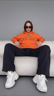 Orange Skull in Bloom hoodie by Dope Beyond – front view on female model
