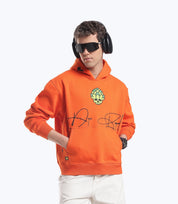 Orange Skull in Bloom hoodie by Dope Beyond – front view on male model
