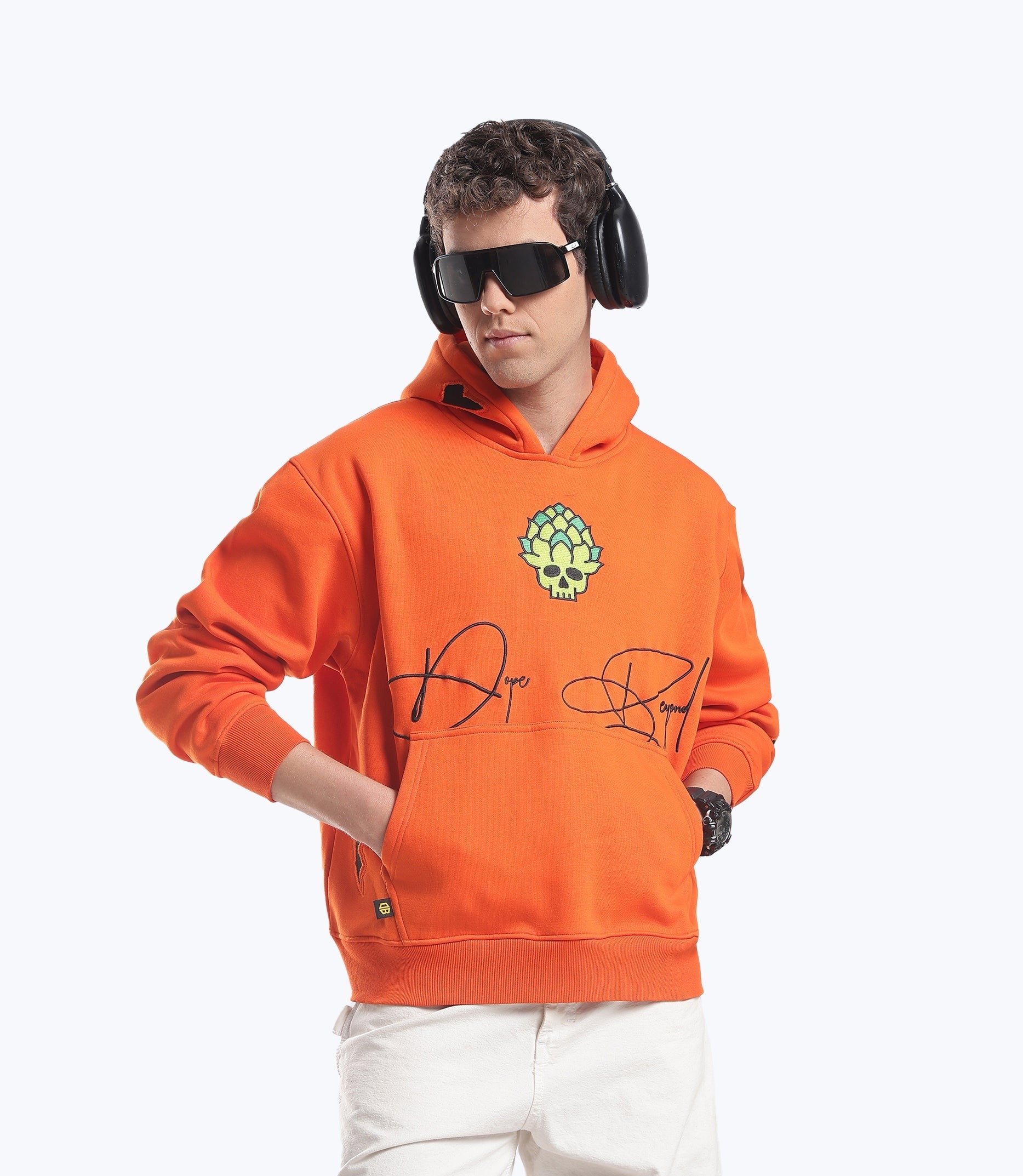 Orange Skull in Bloom hoodie by Dope Beyond – front view on male model